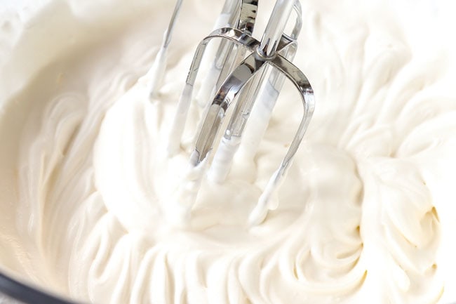 showing how to make peanut butter pie by making homemade whipped cream