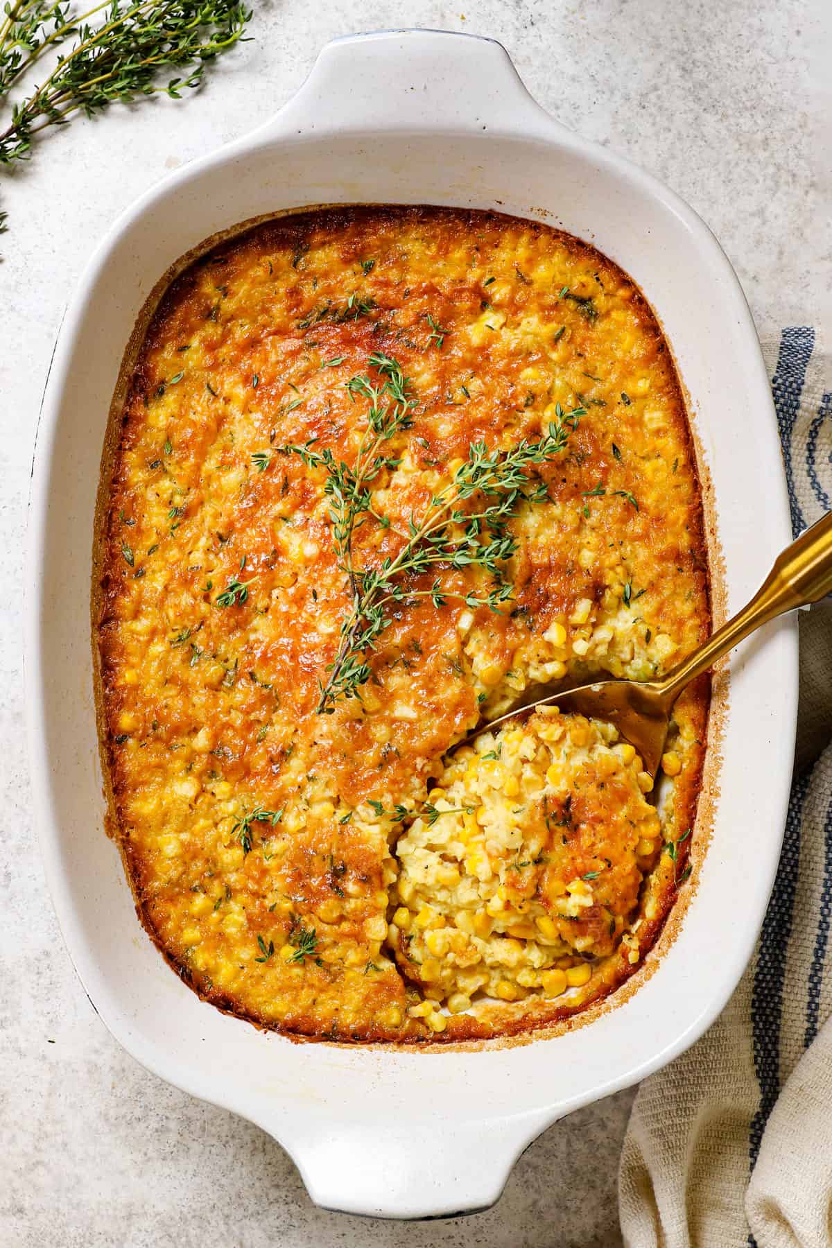 showing how to make corn pudding by resting the baked casserole before serving