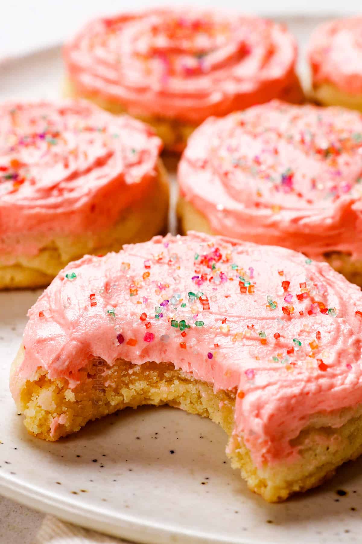 best sugar cookies with a bite taken out of them showing how thick and chewy they are