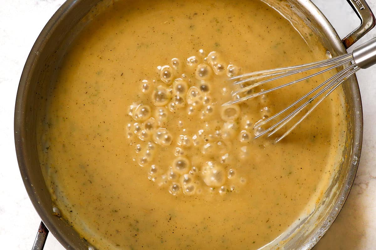 showing how to make turkey gravy by simmering until thickened