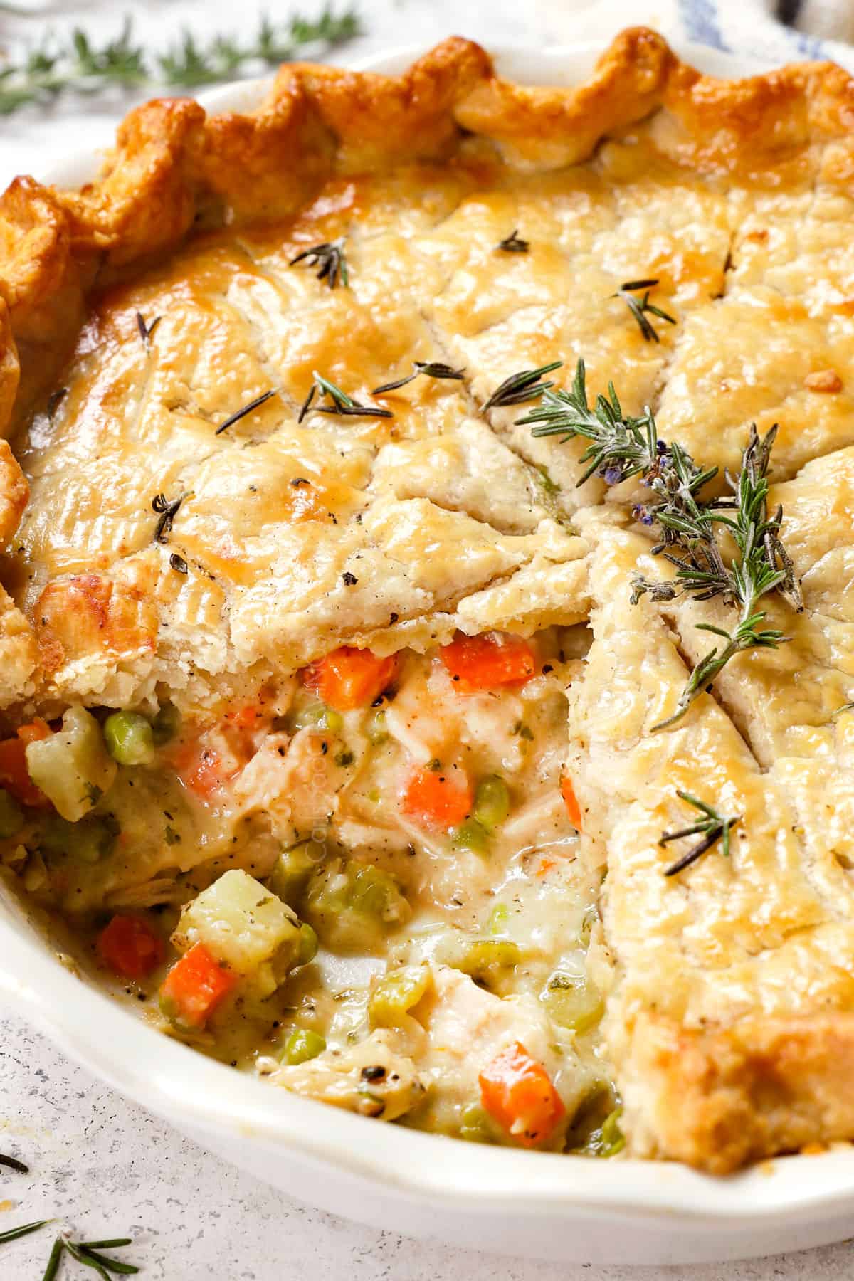 turkey pot pie recipe with a slice removed showing the creamy filling