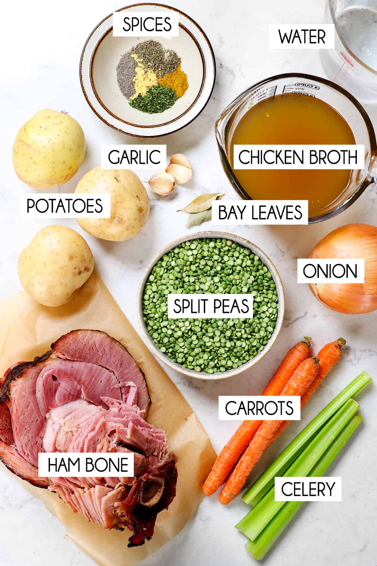 showing the split pea soup ingredients: split peas, ham bone, carrots, celery, potatoes, onion, garlic, chicken broth, water and spices
