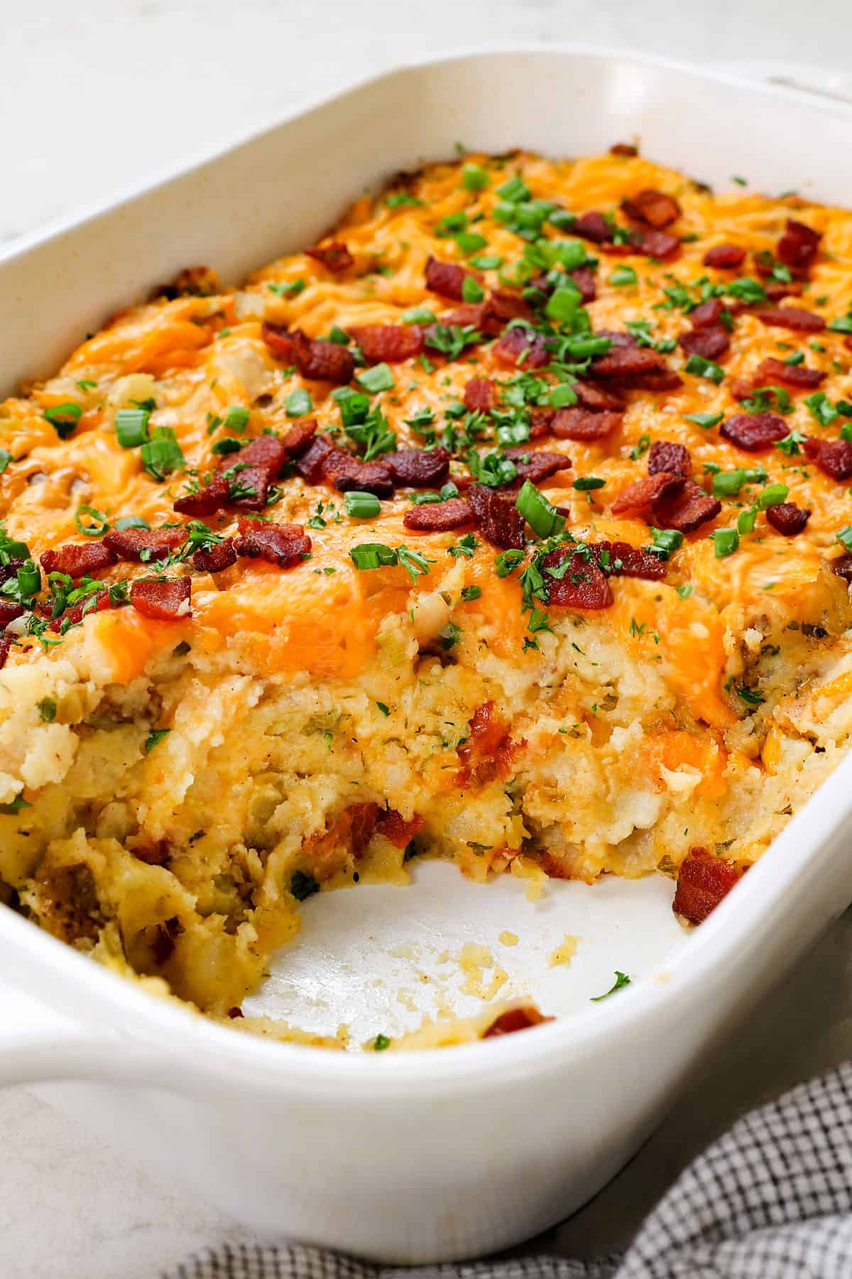 showing the creamy mashed potato inside of Twice Baked Potato Casserole