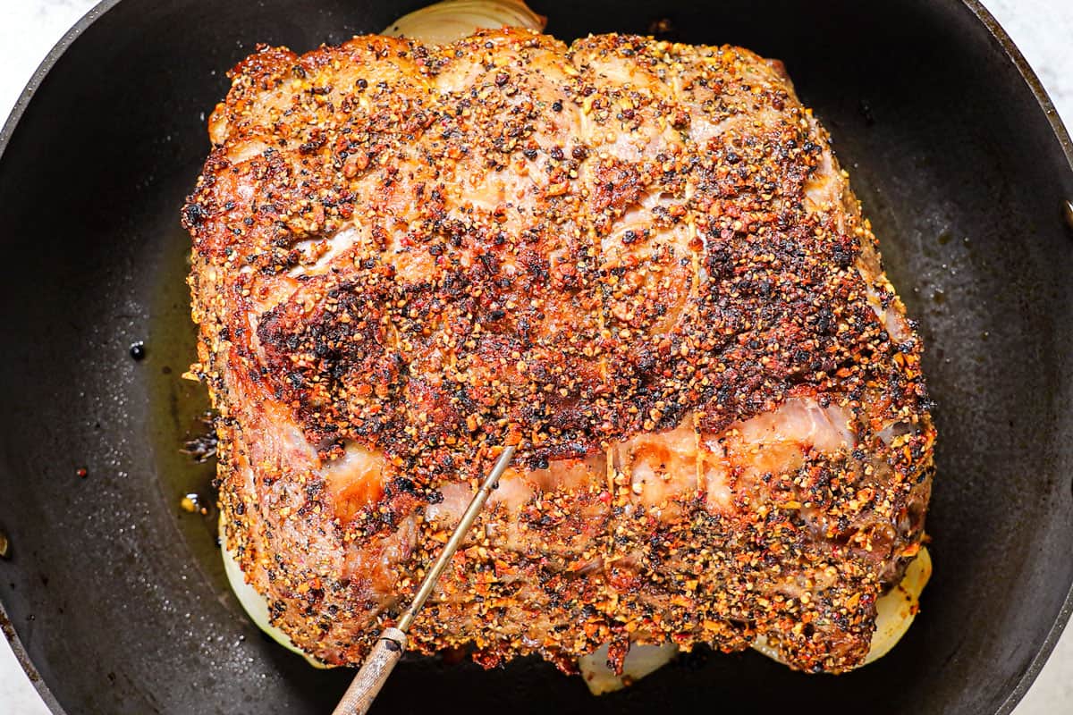 showing how to cook prime rib by searing in the oven for 20 minutes