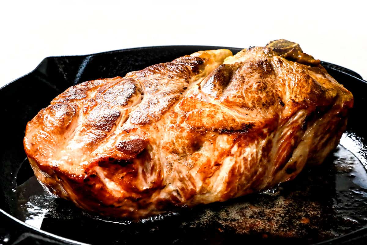 showing how to make carnitas tacos by searing tacos in a cast iron skillet