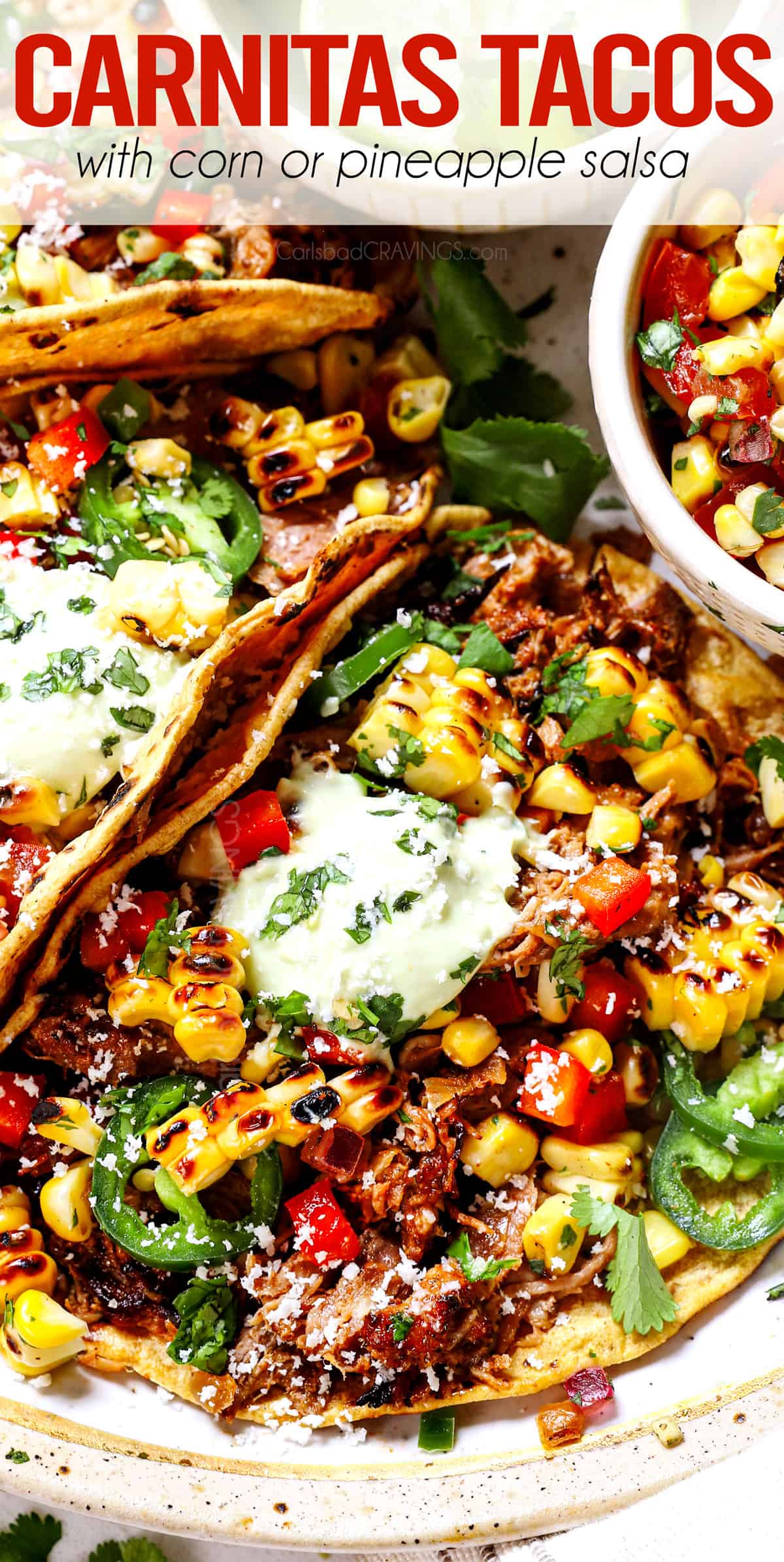 top view of carnitas tacos piled with pork carnitas