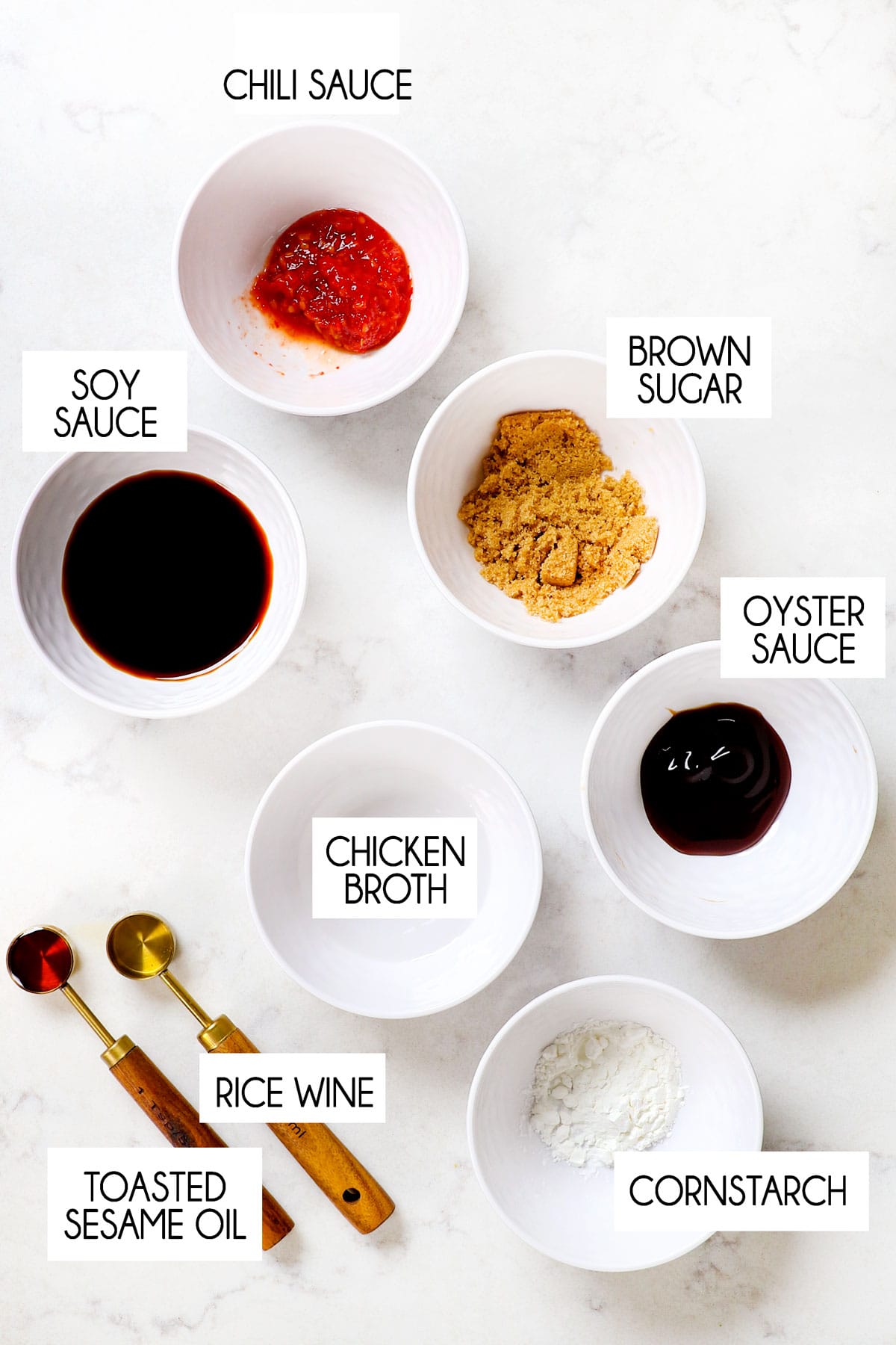 Showing ingredients for ground turkey stir fry sauce: soy sauce, oyster sauce, chicken broth, brown sugar, chili sauce, toasted sesame oil, rice wine