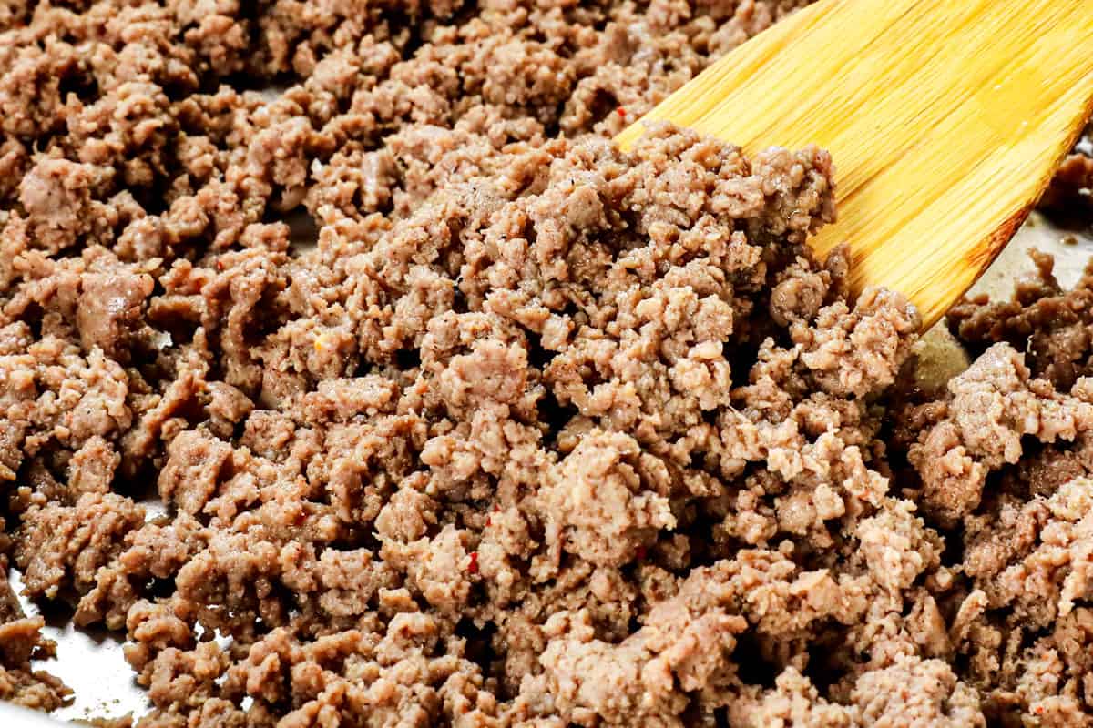 showing how to make ground turkey stir fry by browning the turkey in a skillet