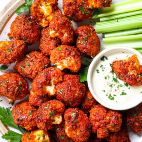 top view of serving buffalo cauliflower on a plate garnished by parsley