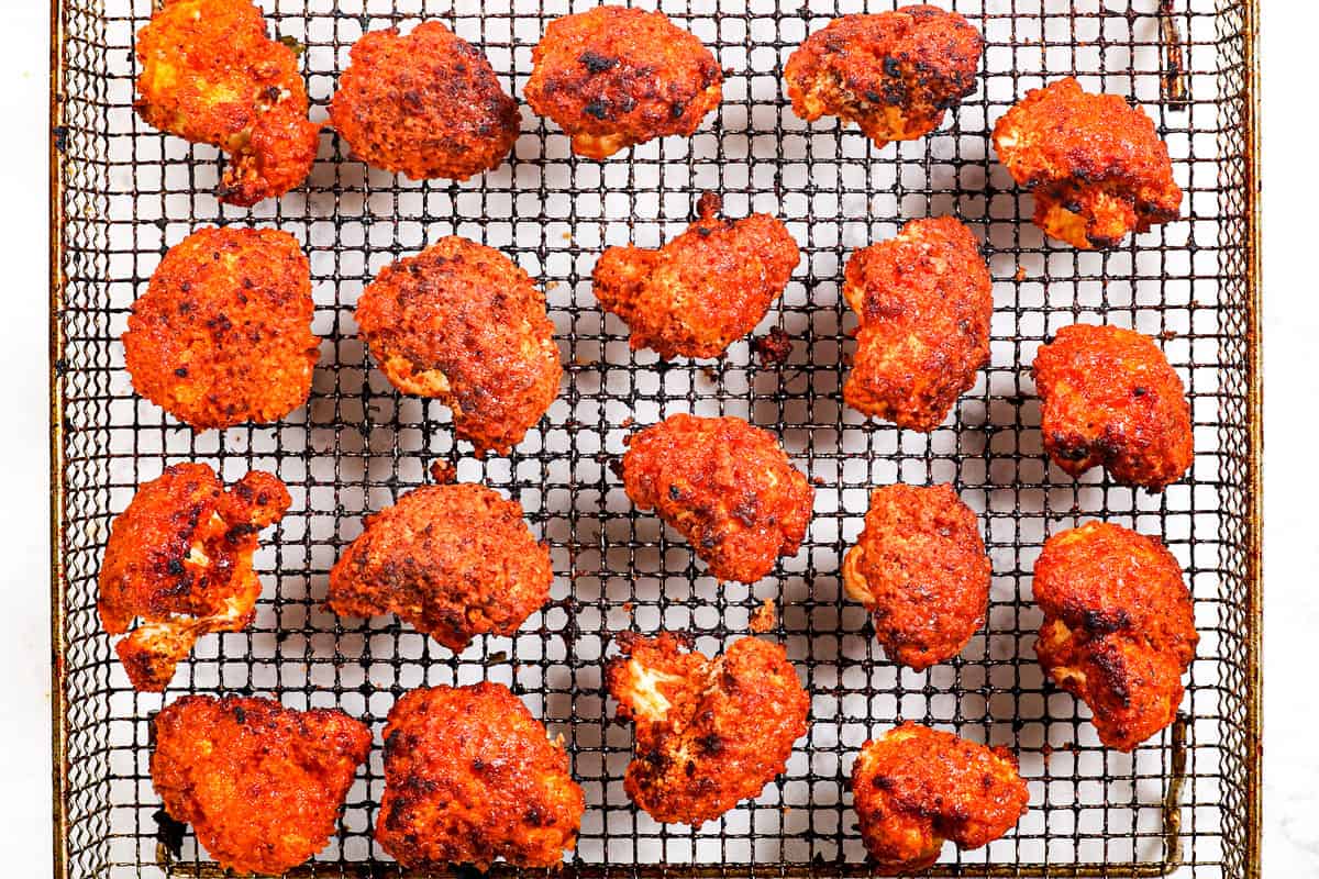 showing how to air fry buffalo cauliflower until crispy