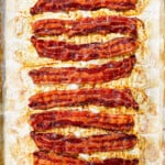 showing how to cook bacon in the oven by cooking until crispy