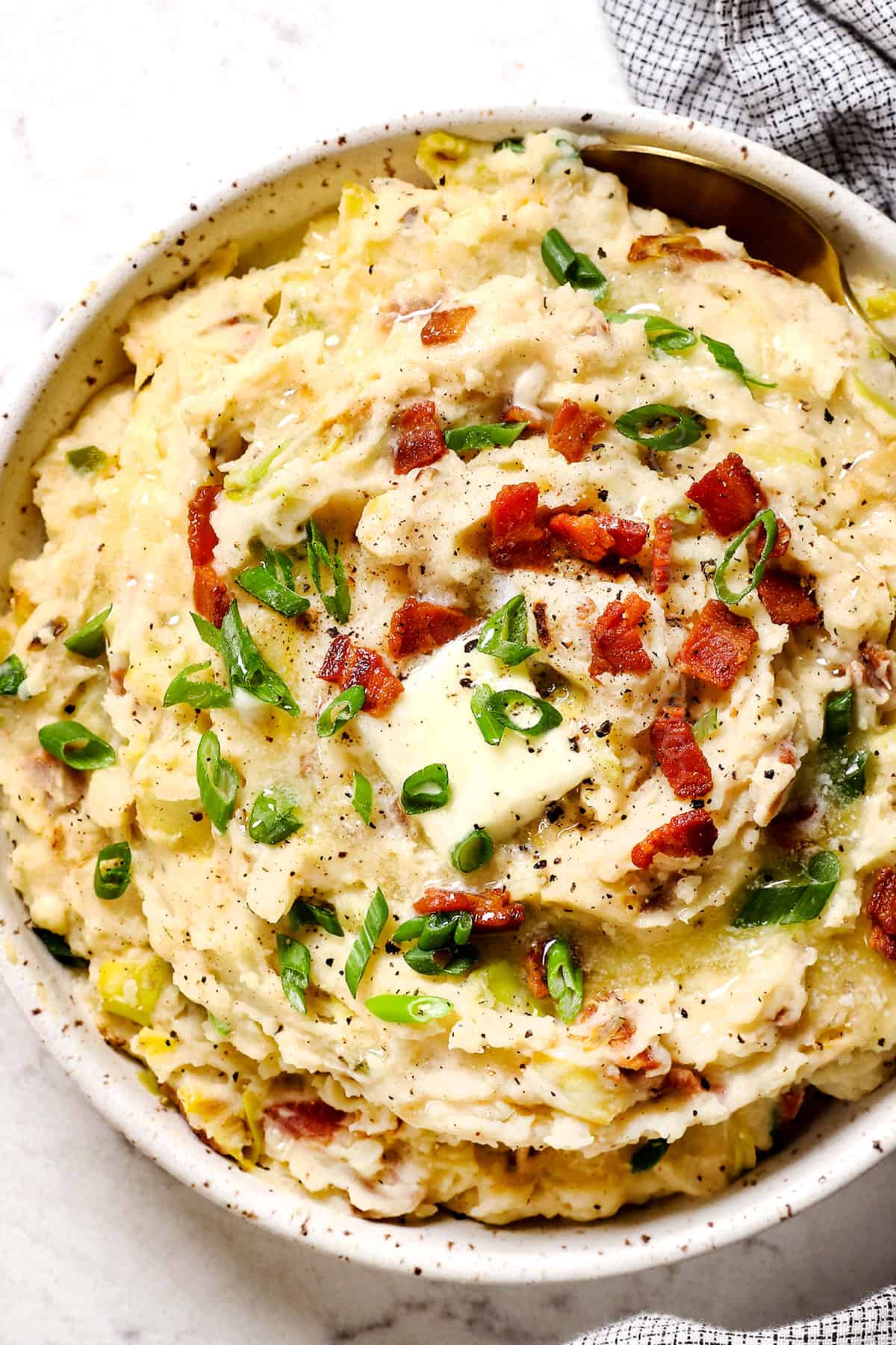 top view of serving colcannon potatoes with a melted butter on top
