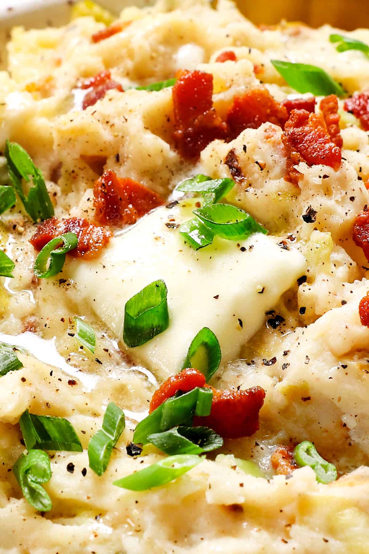 showing how to make colcannon recipe by adding butter to melt on top