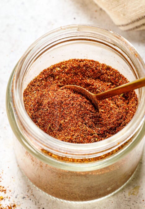 showing how to make taco seasoning by adding to an airtight container