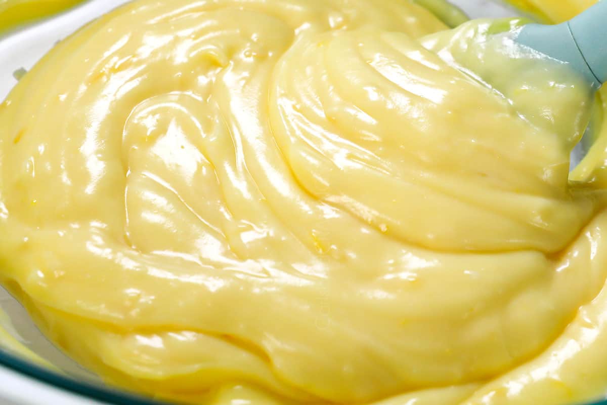 showing how to make lemon pie recipe by stirring in sour cream