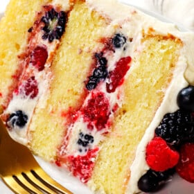 a slice of Chantilly cream cake on a plate showing the layers