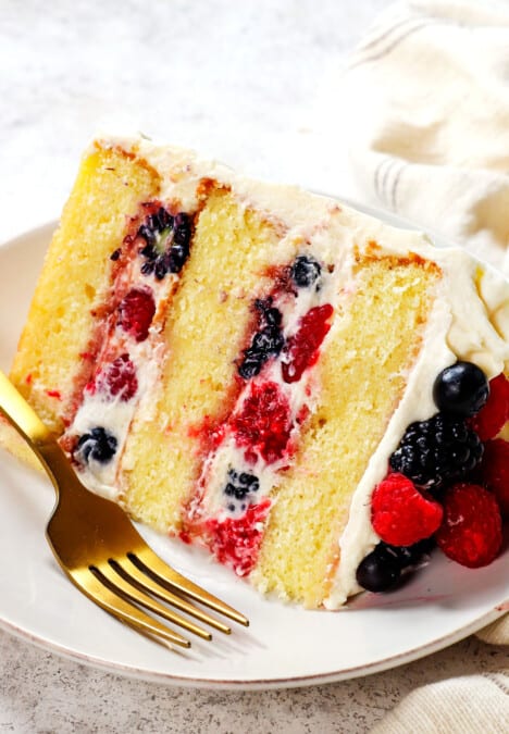 a slice of Chantilly cream cake on a plate showing the layers