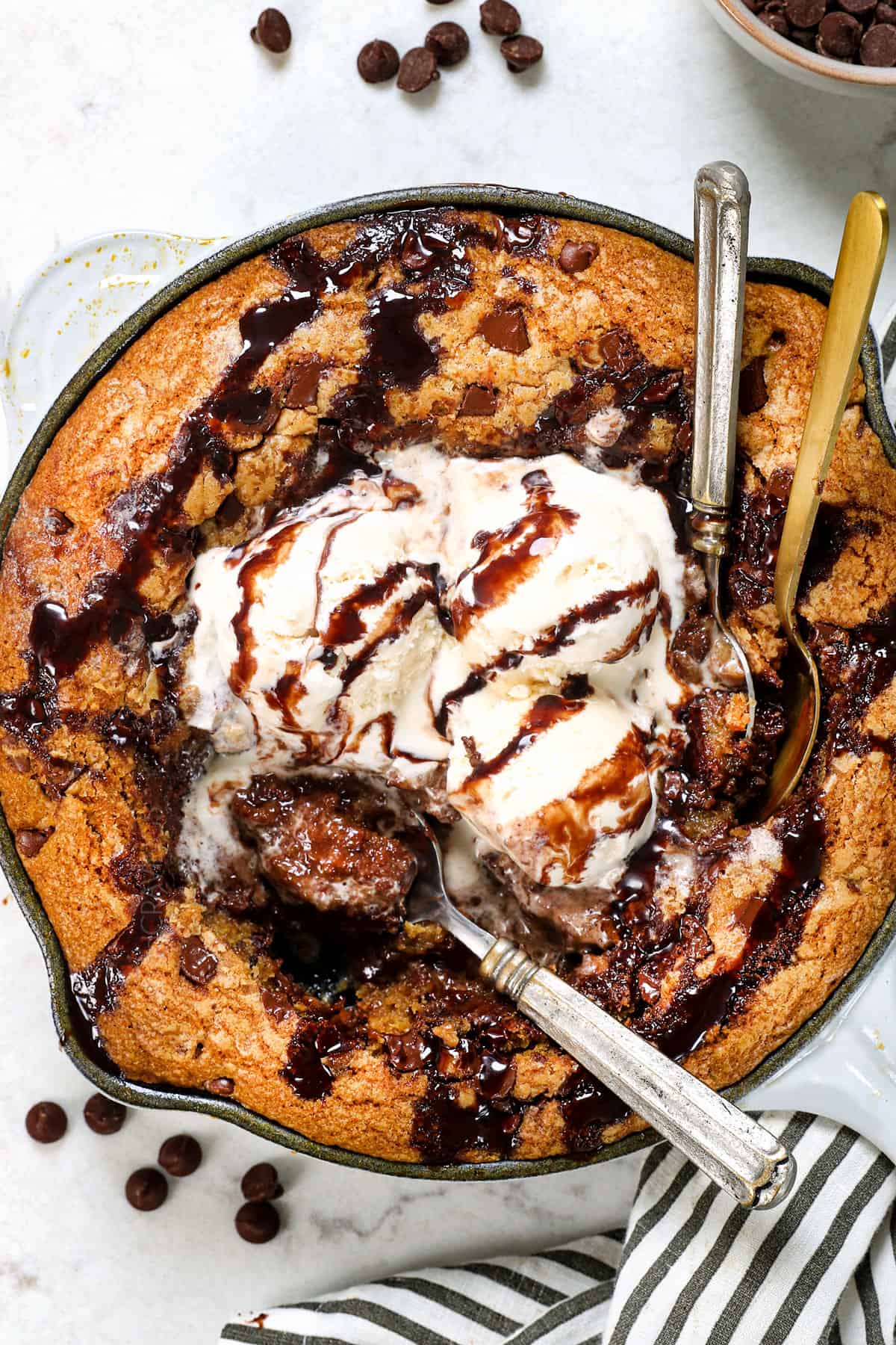 showing how to serve skillet cookie with spoons