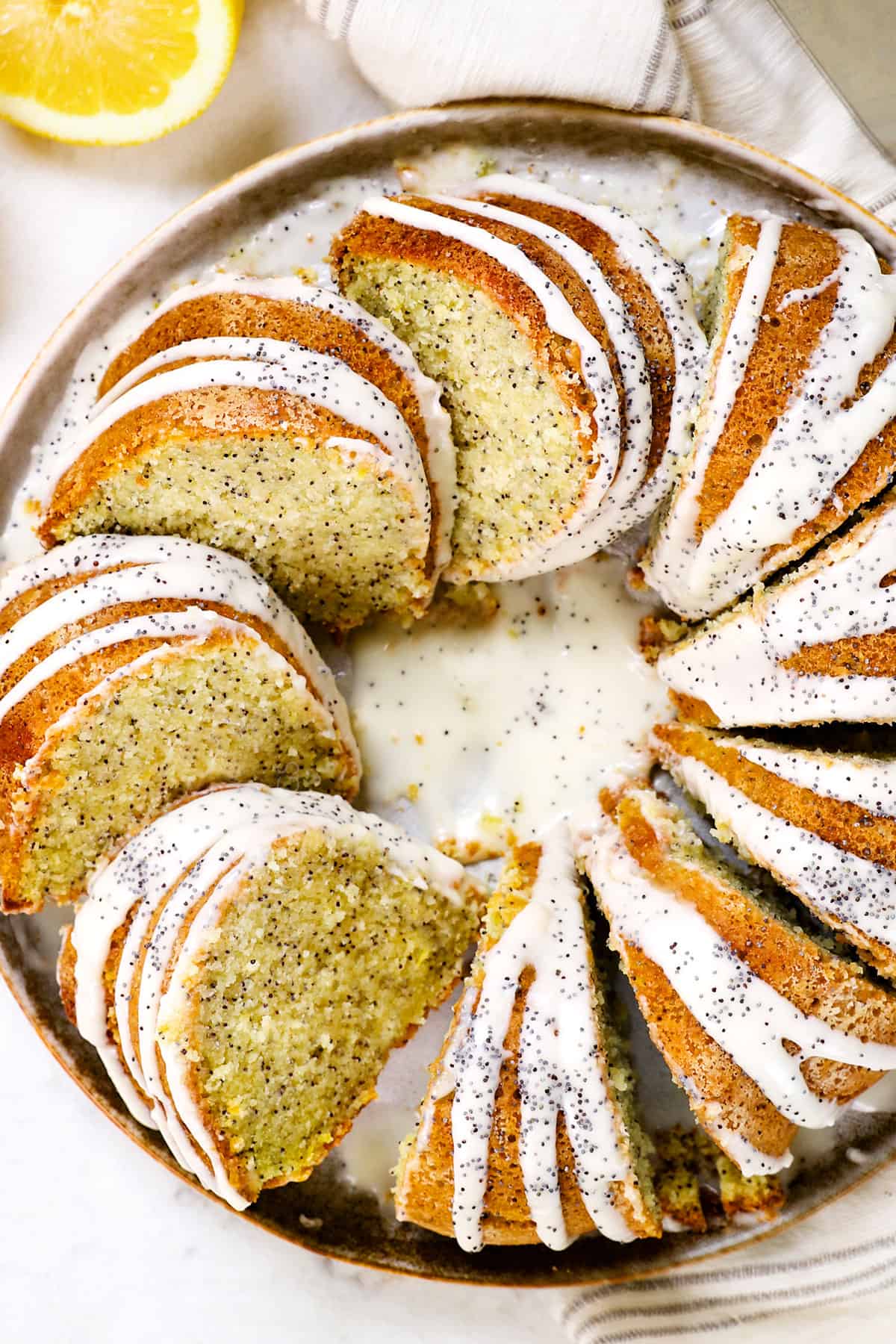 top view of poppy seed cake cut into slices drizzled with glaze