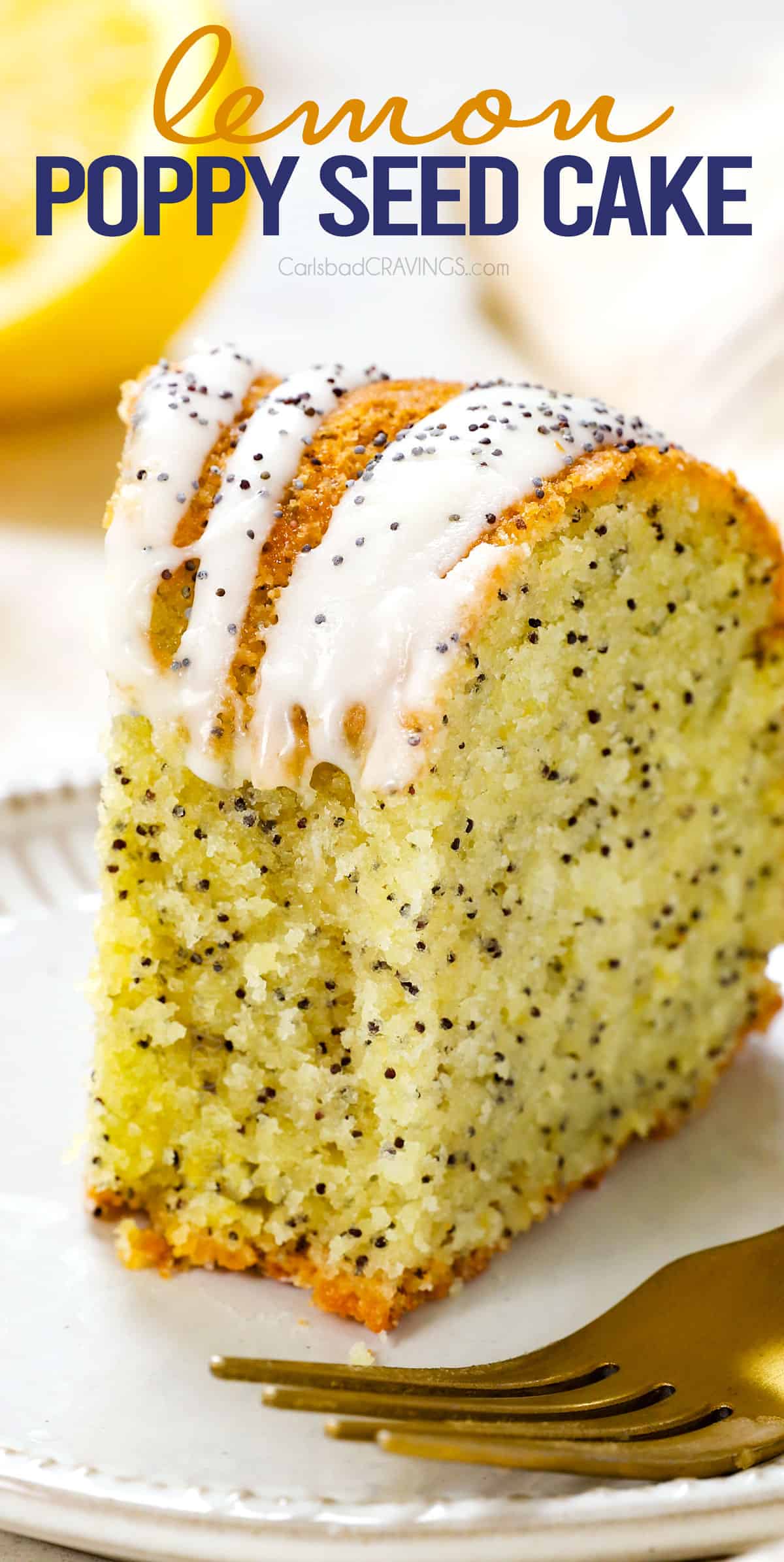 up close of lemon poppy seed cake with a bite taken out showing how tender the cake is