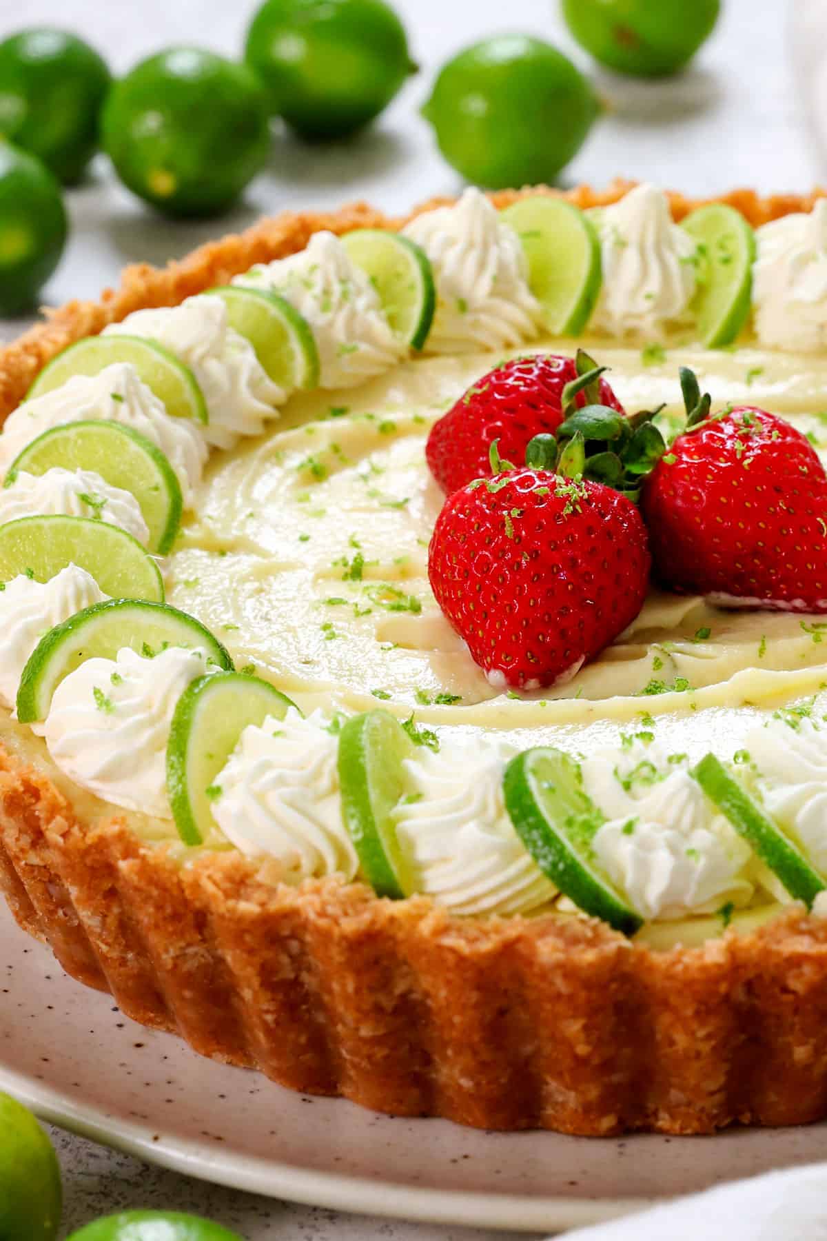 showing how to make key lime pie by topping with whipped cream
