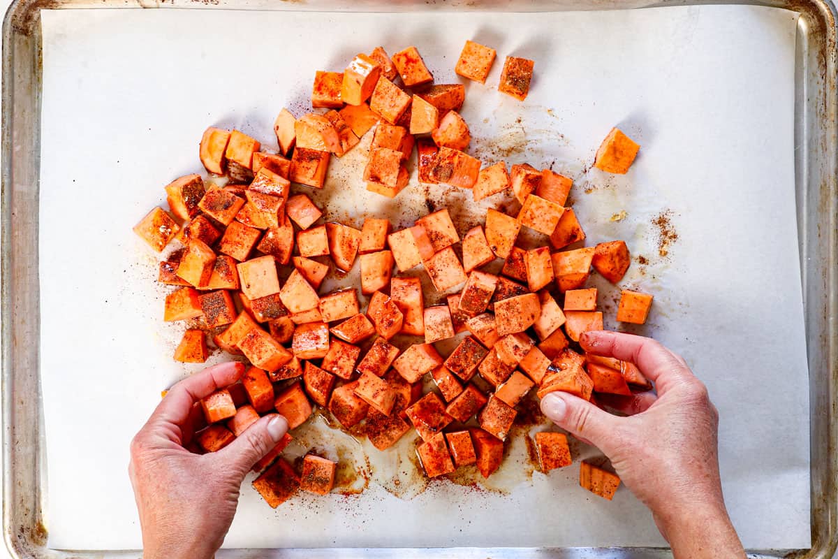 how to roast sweet potatoes by tossing the potatoes in olive oil and spices