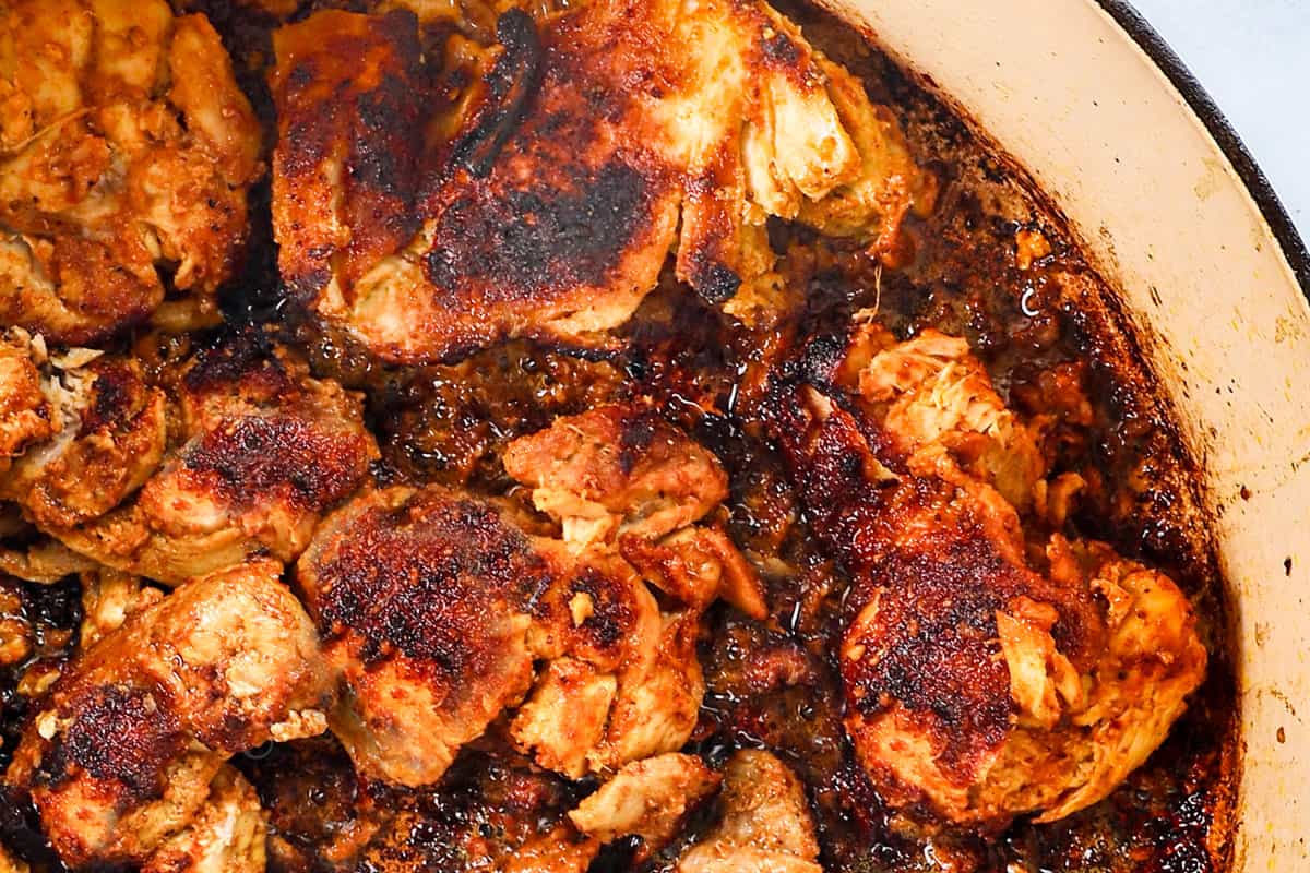 showing how to make biryani by cooking the chicken