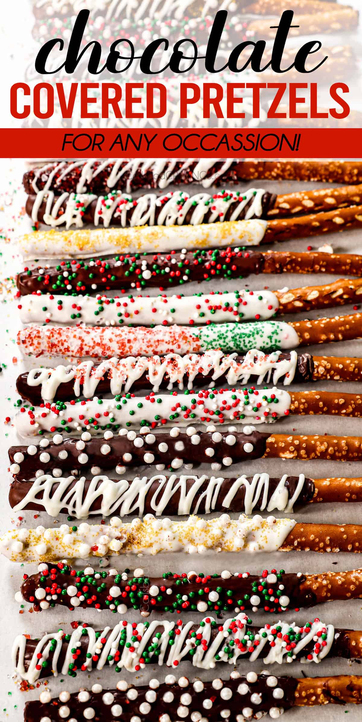 top view of chocolate dipped pretzels lined on parchment paper decorated with chocolate drizzle and sprinkles
