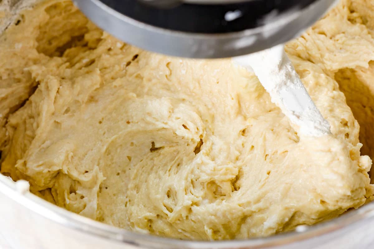 showing how to make coffee cake by mixing in the flour and milk