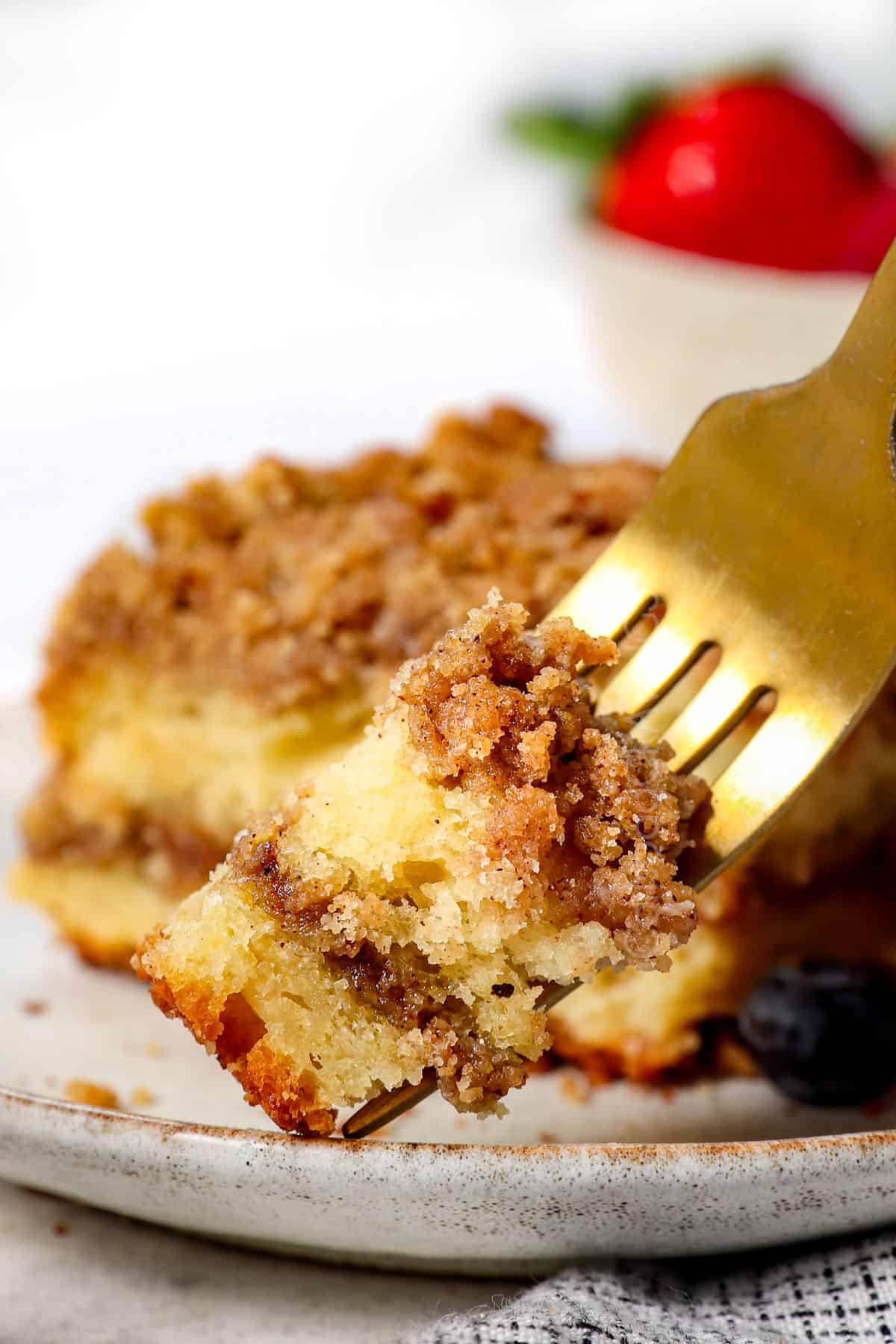 a forkful of coffee cake showing the moist, fluffy, tender cake