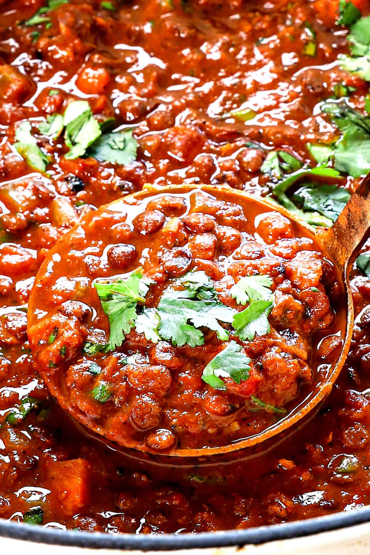 a large ladleful of lentil soup showing the thick and creamy consistency