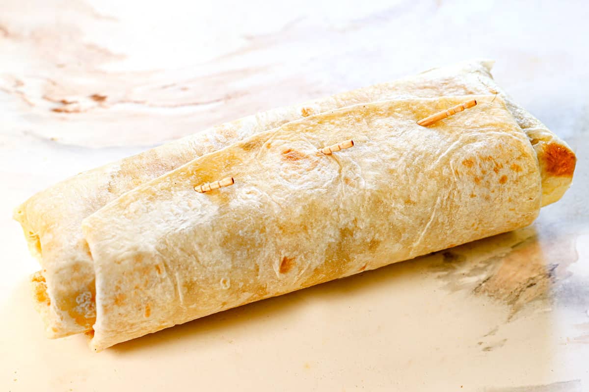 showing how to make chimichangas by securing with toothpicks