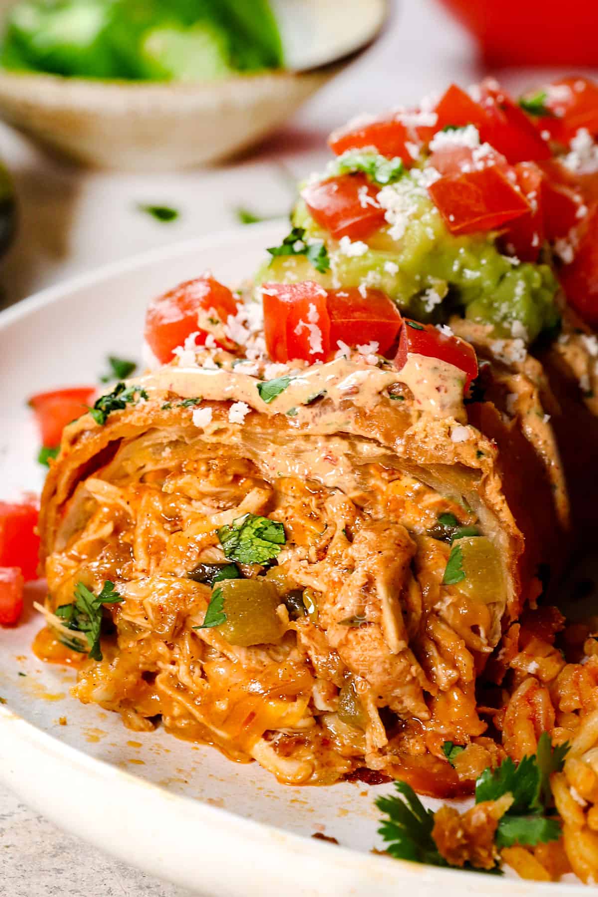up close of chicken chimichanga recipe showing the cheesy chicken fall out