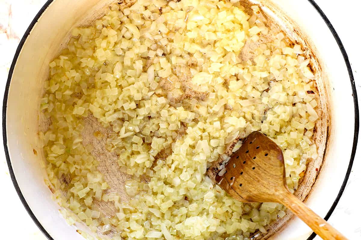 showing how to make chicken taco soup by sautéing onions in a pot
