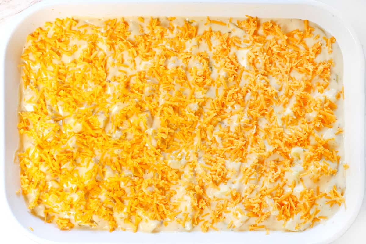 showing how to make cheesy potatoes by topping with cheese and baking