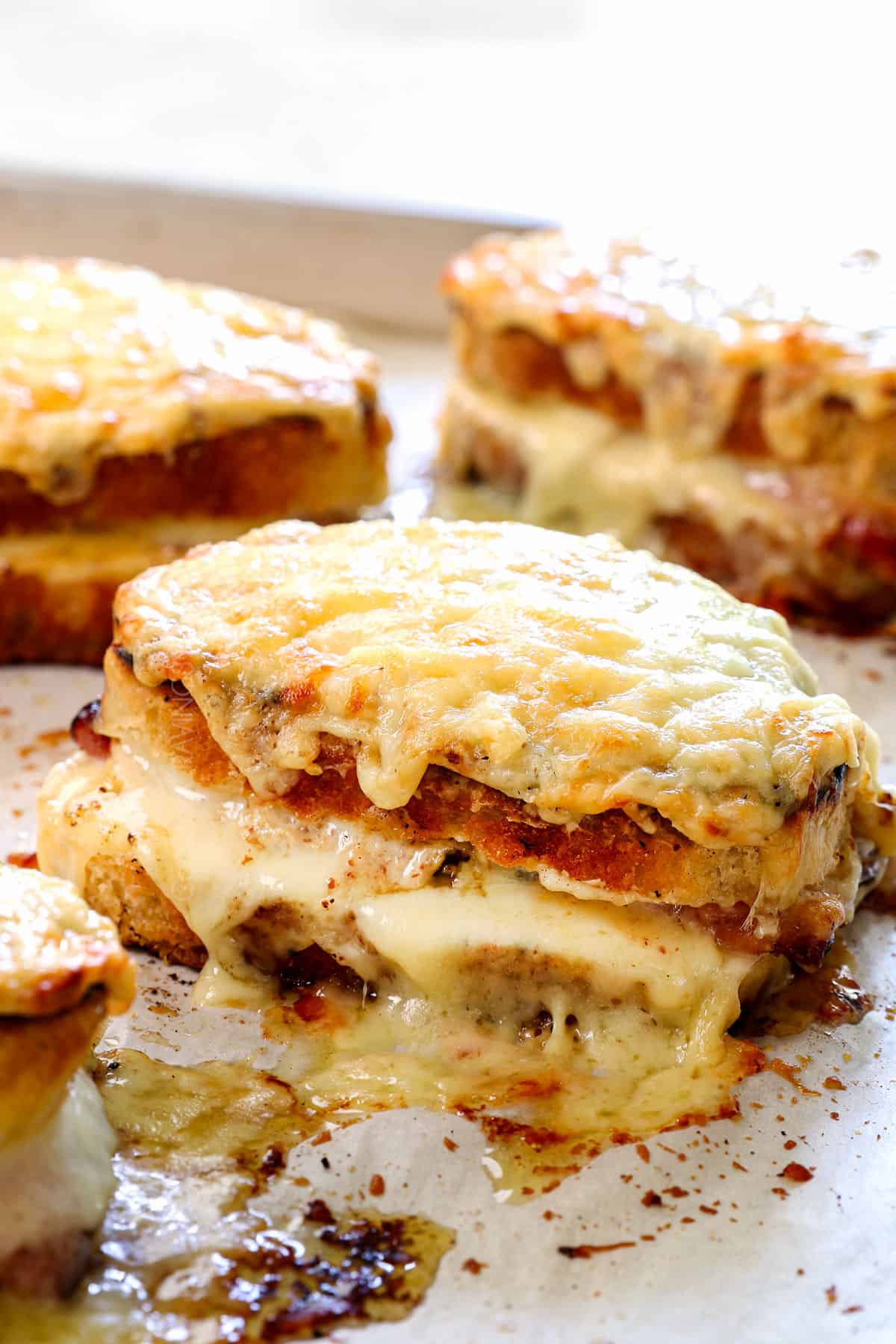 croque monsieur recipe on a baking sheet after broiling, showing the signature top golden cheesy, bubbly top