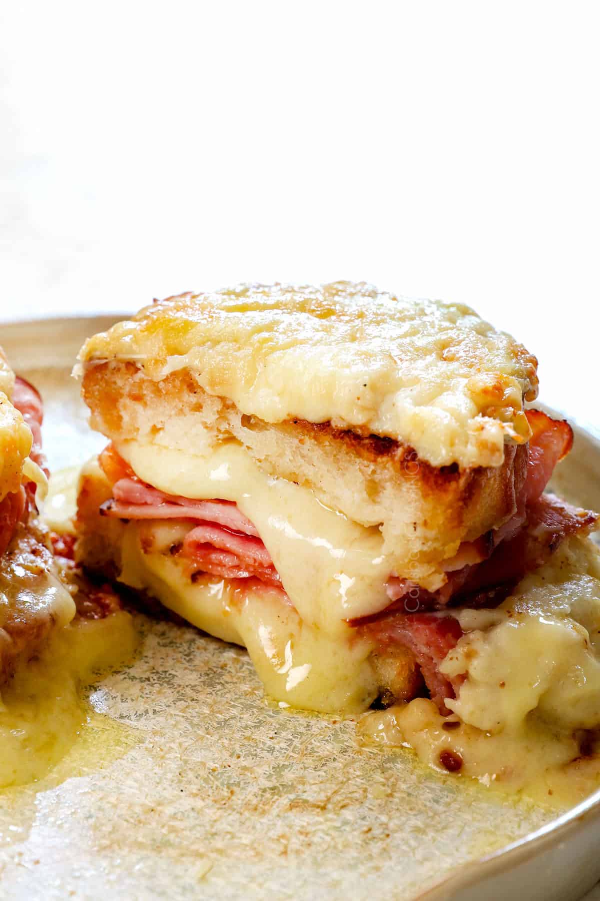 croque monsieur sandwich cut in half on a plate showing how to serve
