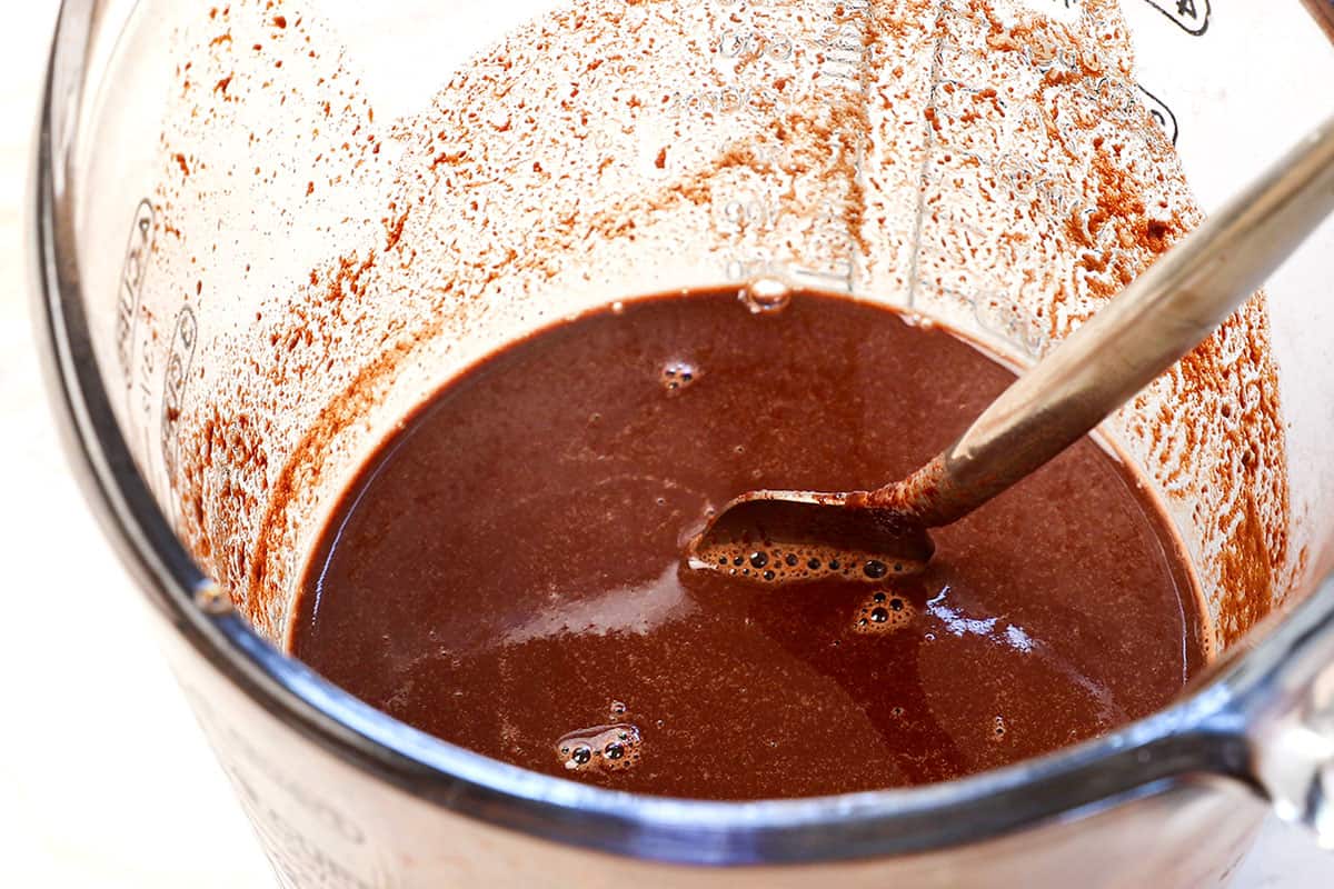 showing how to make German Chocolate Cake by melting German chocolate in a bowl with hot water