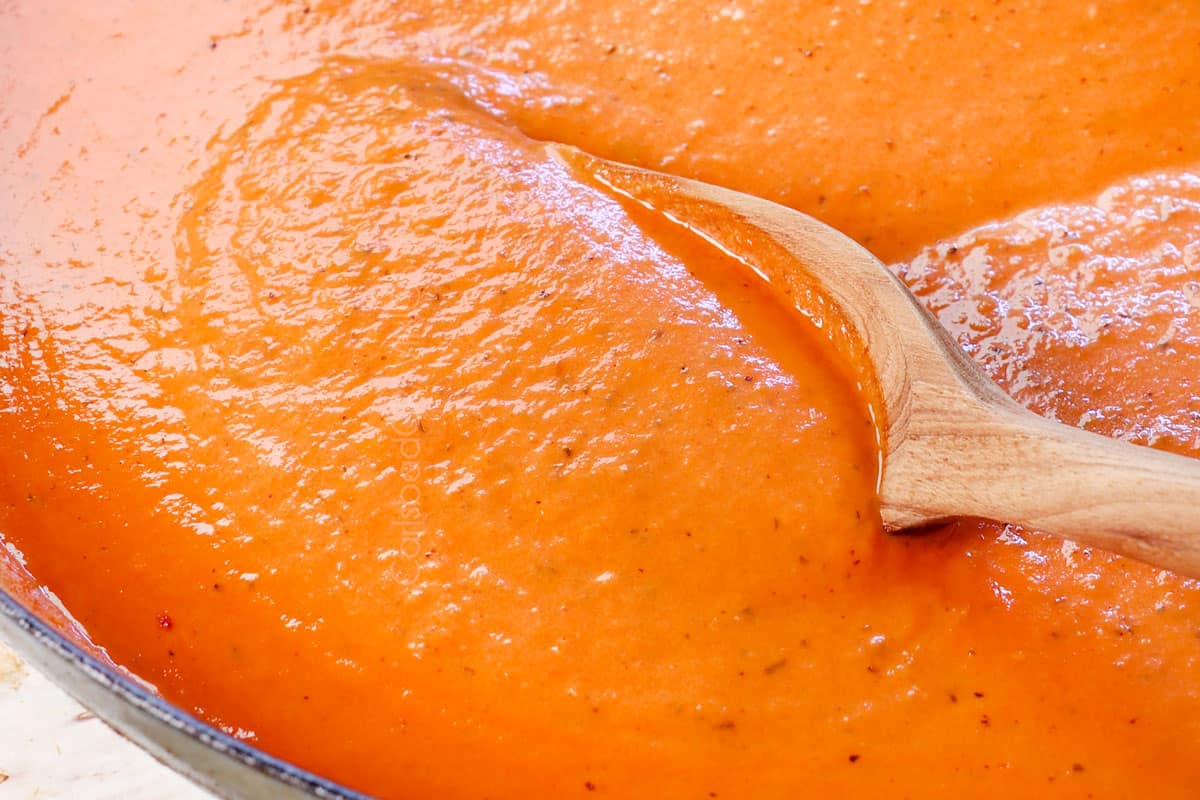 showing how to make pink sauce by stirring in the cream until velvety smooth