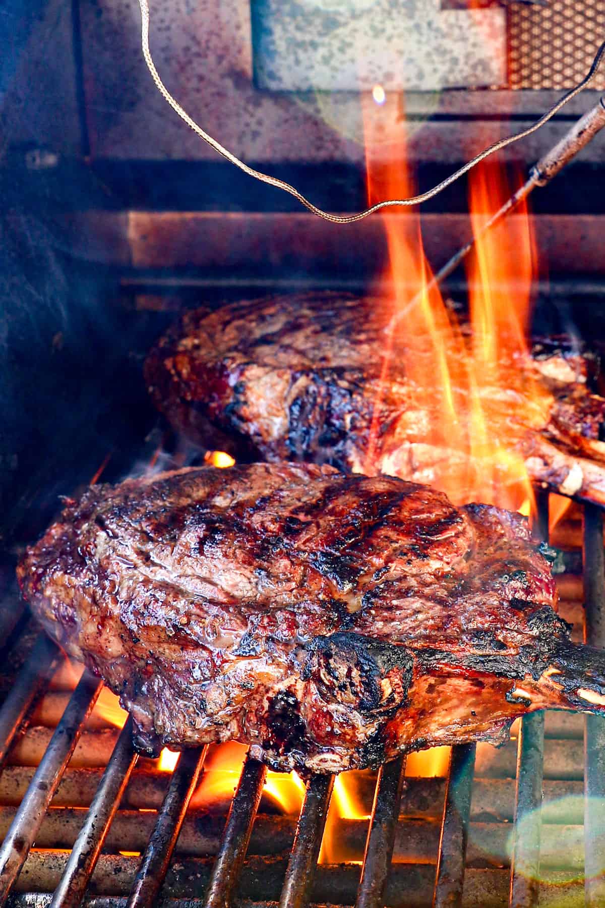 showing how to cook tomahawk steak by searing over high heat