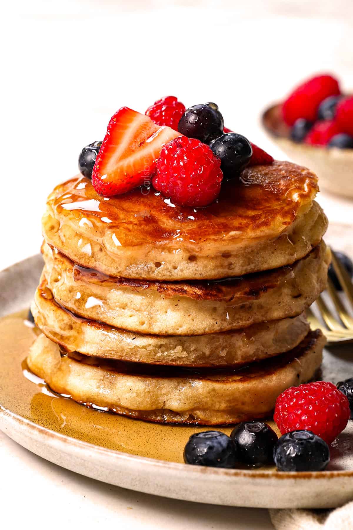 best fluffy pancake recipe served on a plate garnished with berries
