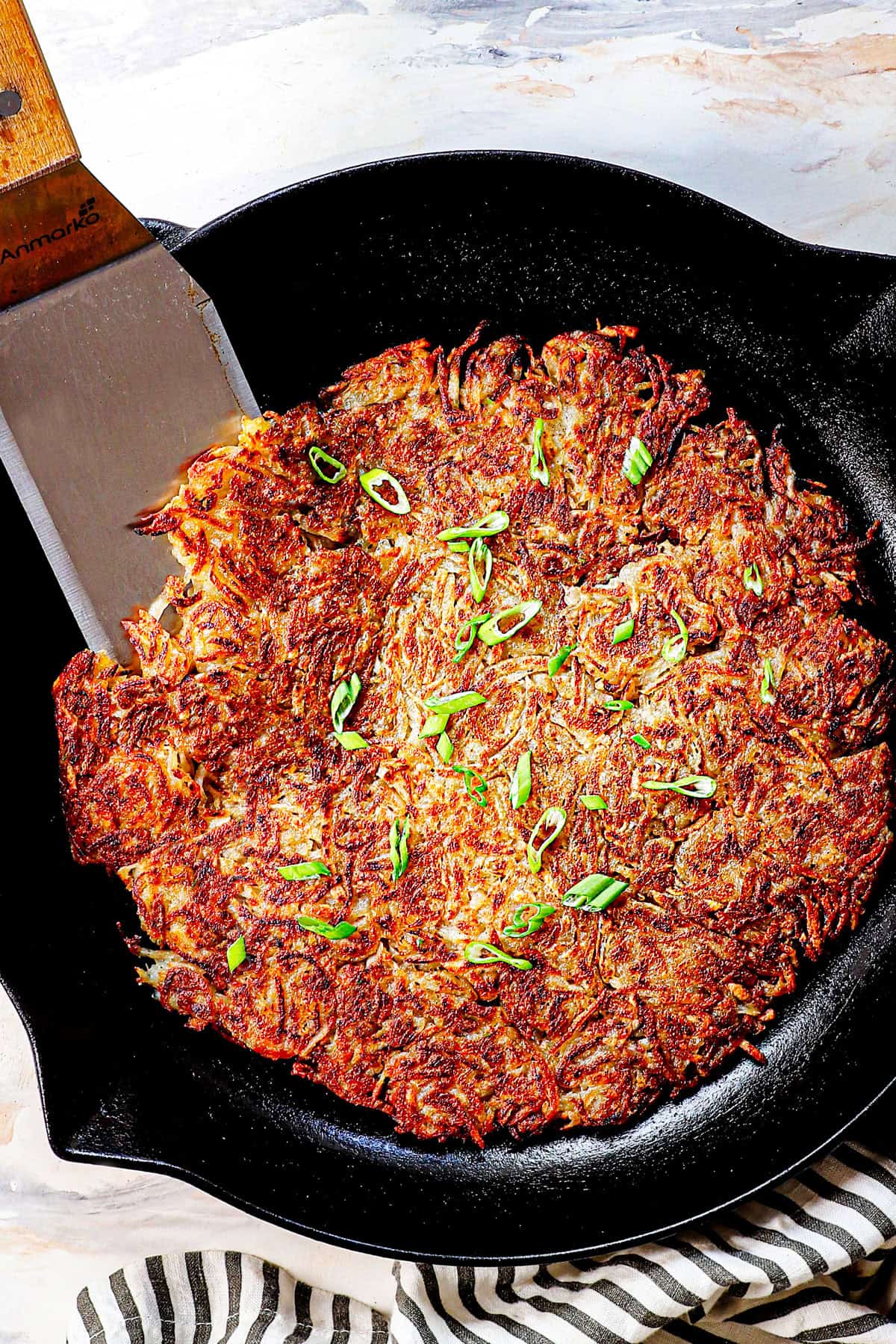 showing how to make hash browns by cooking until both sides are golden and crispy