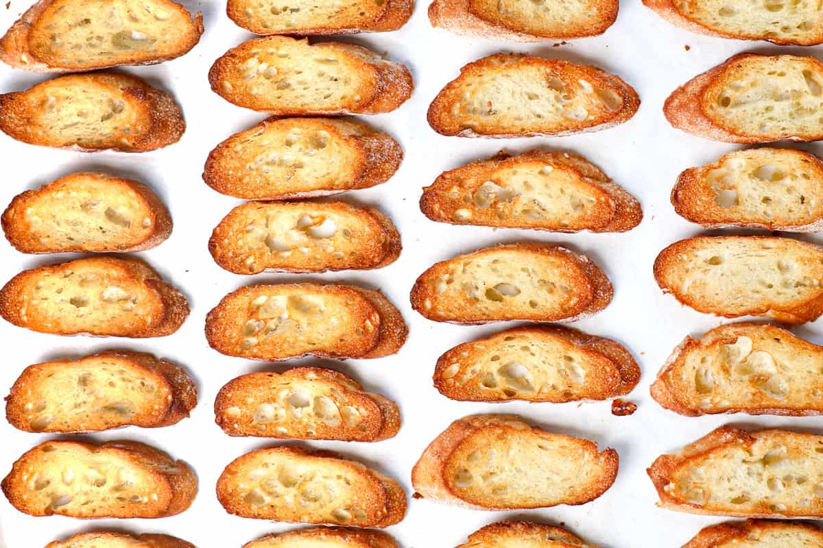 showing how to make bruschetta by baking the bread until golden, then broiling for 1-2 minutes until crispy