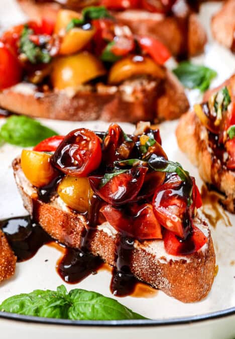 up close of bruschetta drizzled with balsamic glaze
