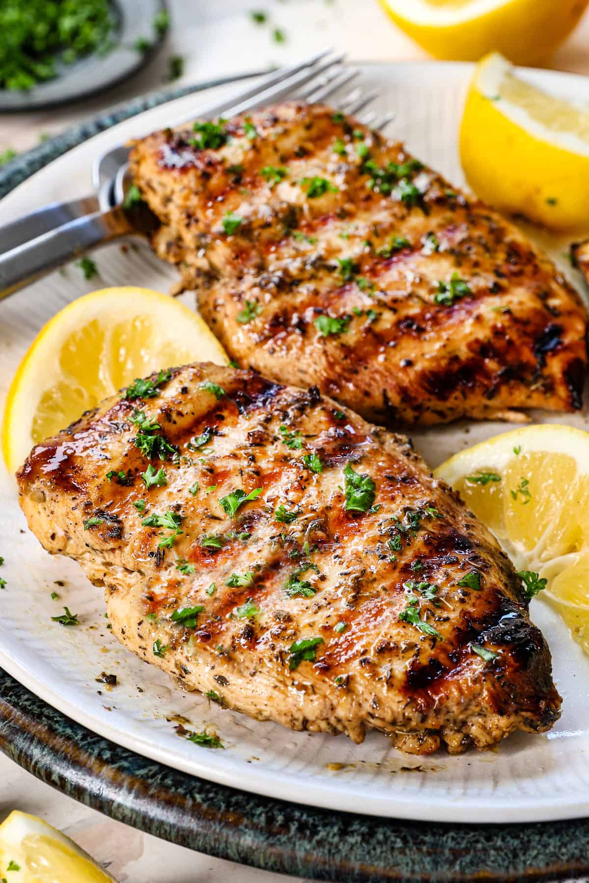 showing how to make grilled chicken by grilling, and letting it rest before slicing.