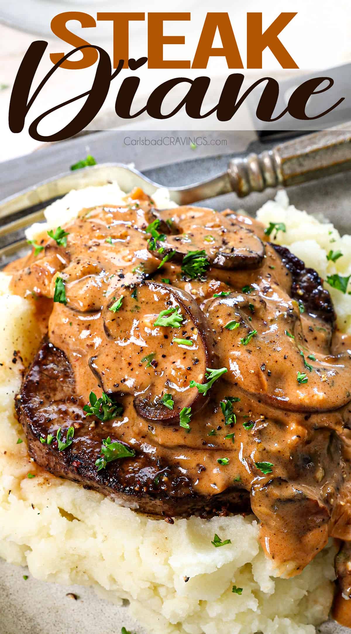 up close of steak Diane being served on a bed of mashed potatoes