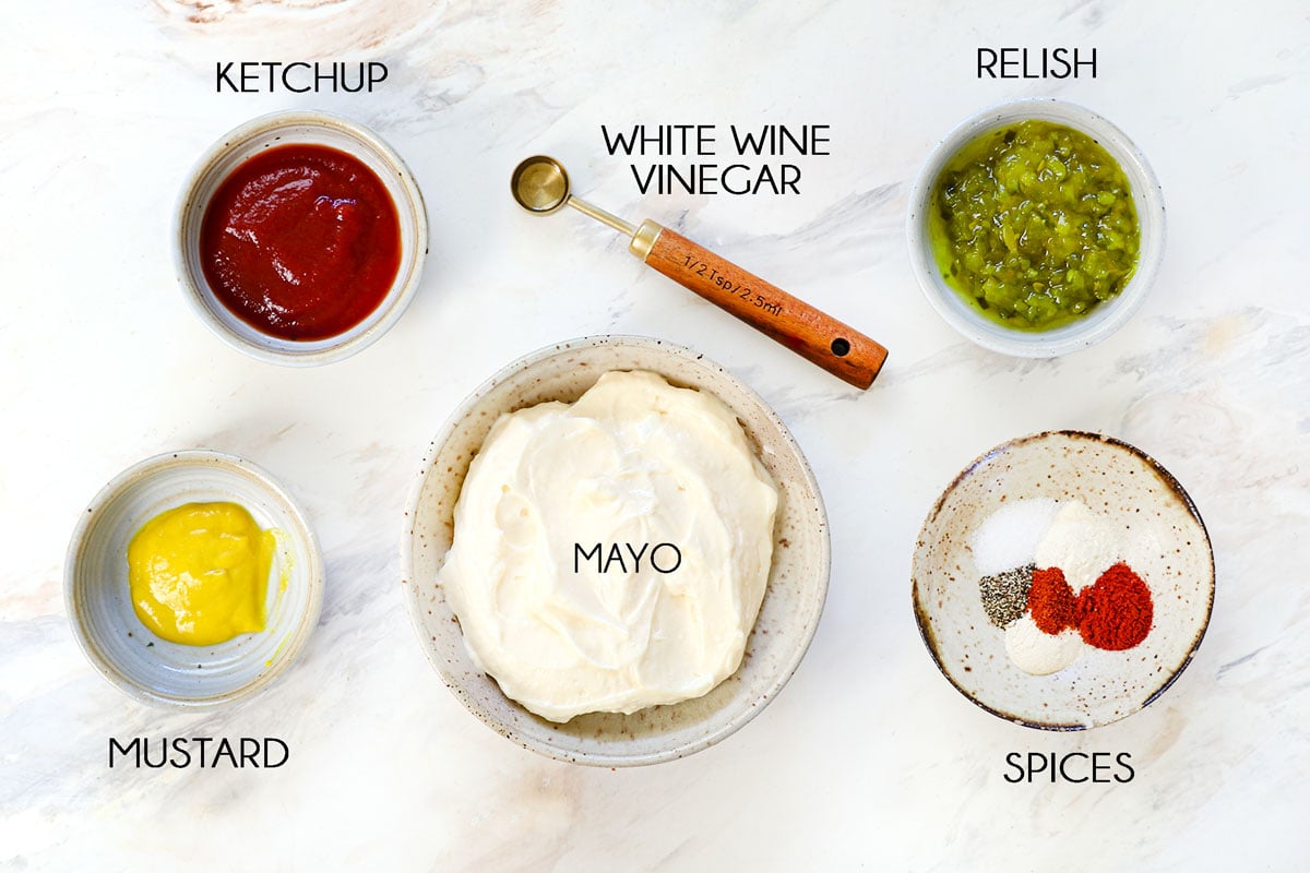 top view of smash burger sauce ingredients: mayonnaise, ketchup, mustard, relish, vinegar, paprika, onion powder, garlic powder, salt and pepper