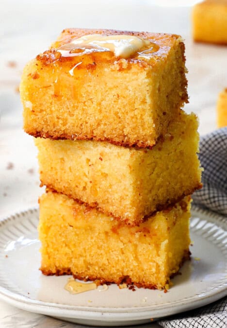 a stack of cornbread showing how thick, tall, and moist the slices are