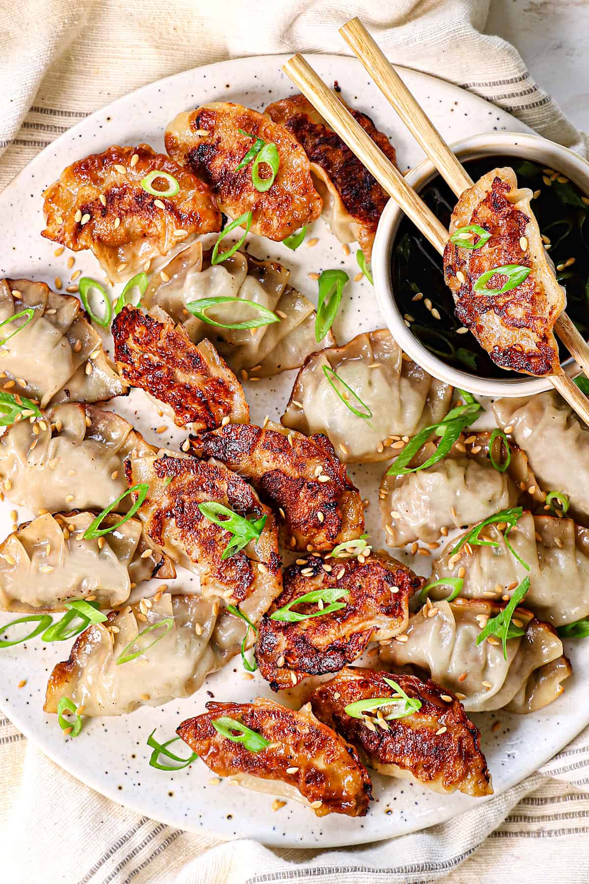 top view of gyoza recipe on a plate showing the golden, seared bottoms and tender tops