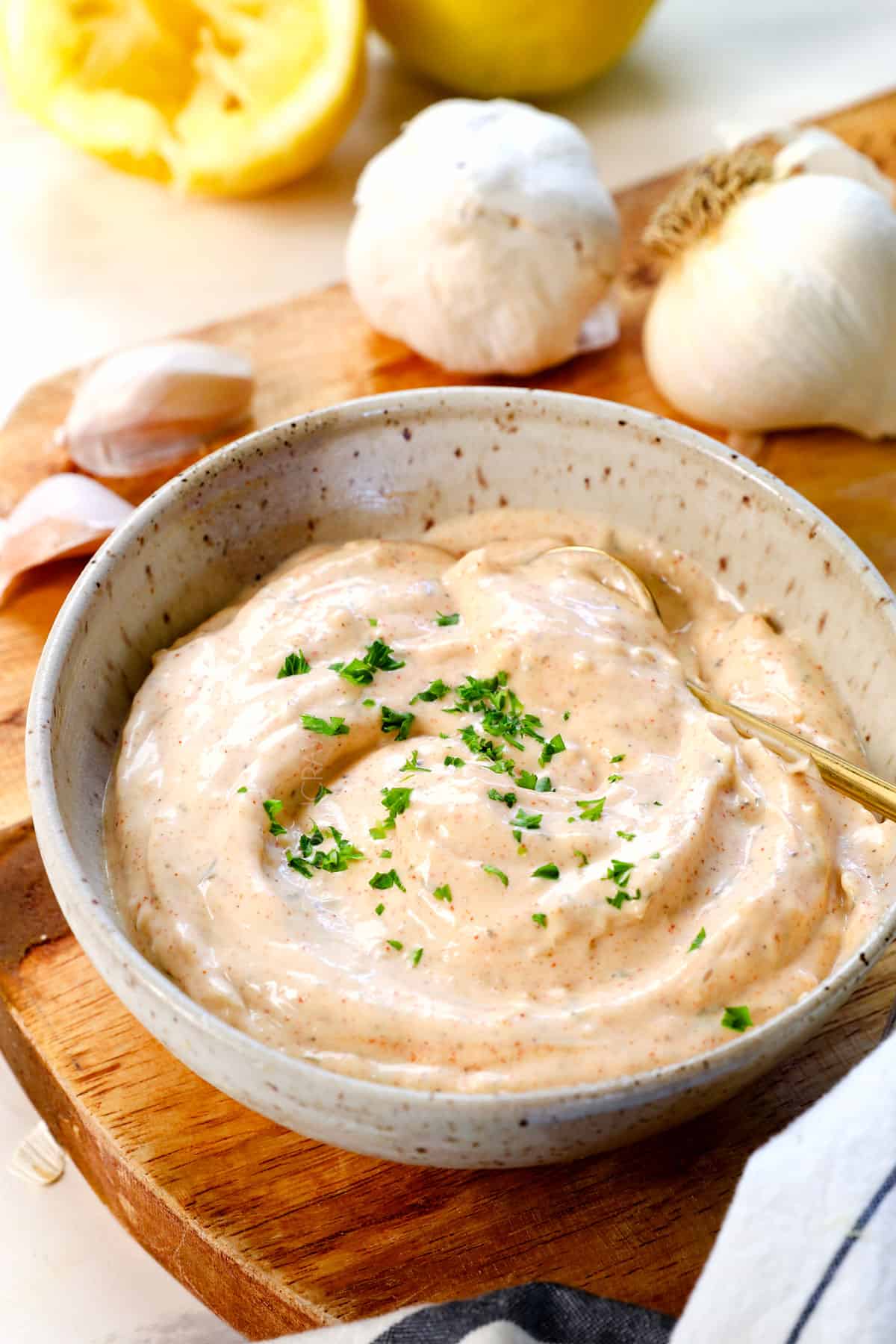 homemade garlic aioli in a bowl showing how creamy it is
